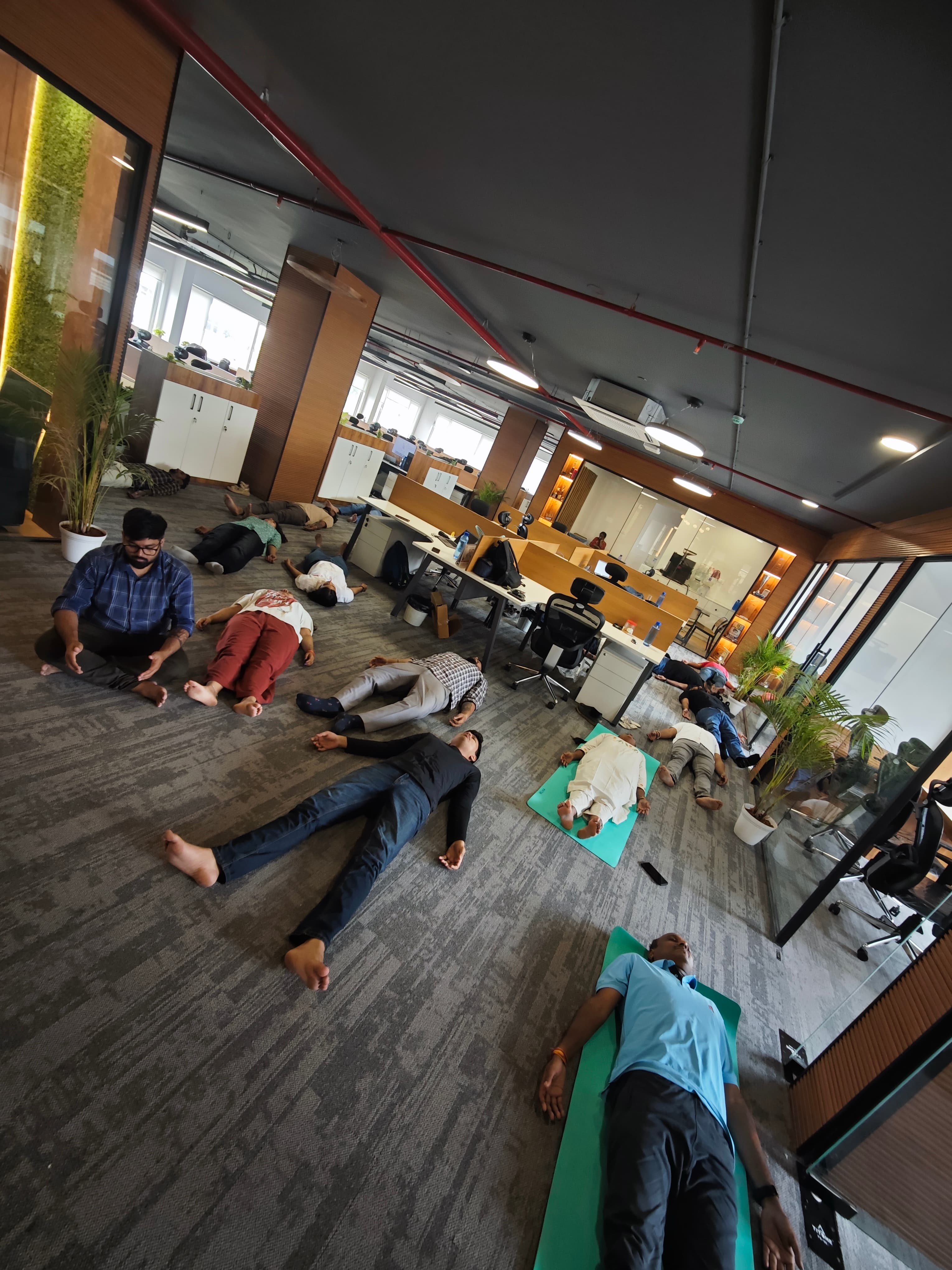 Participants resting during a guided workplace relaxation practice