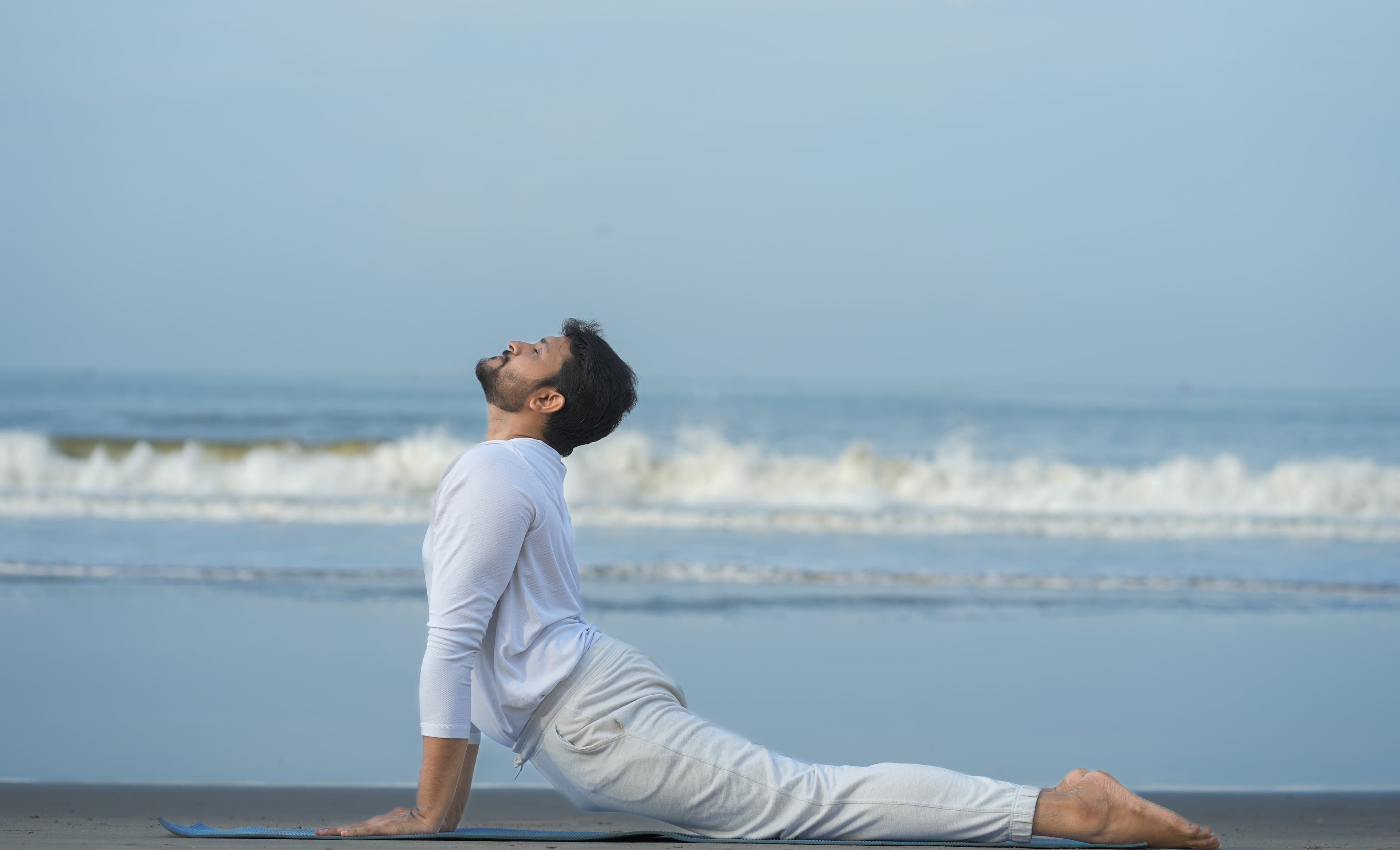 Cobra pose practice by the sea
