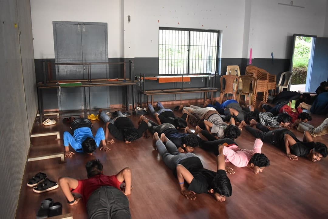 Students practising movement together on a workshop floor