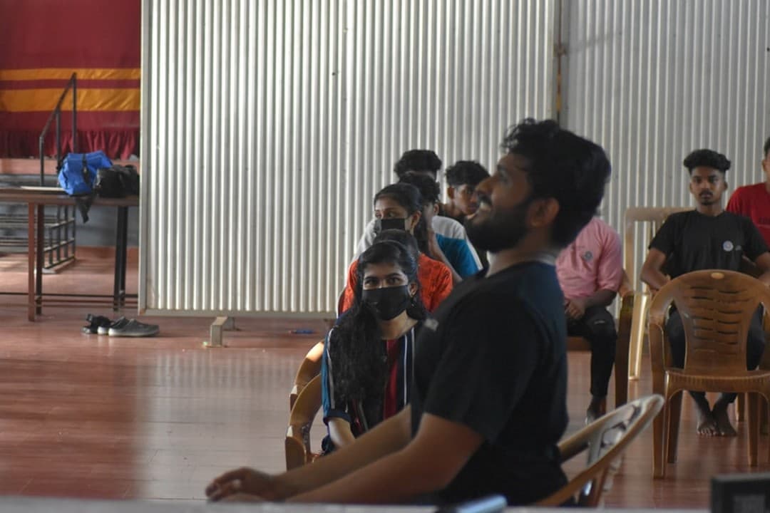 Workshop facilitator speaking with seated students