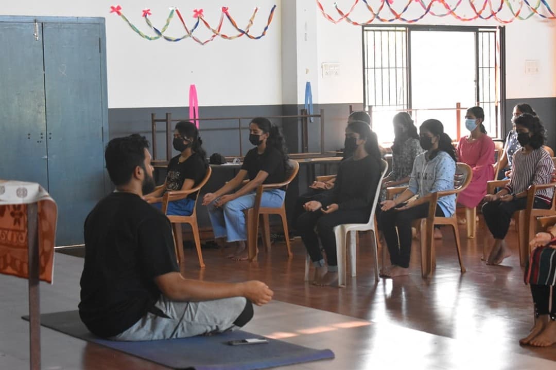 Students practising seated breathing together