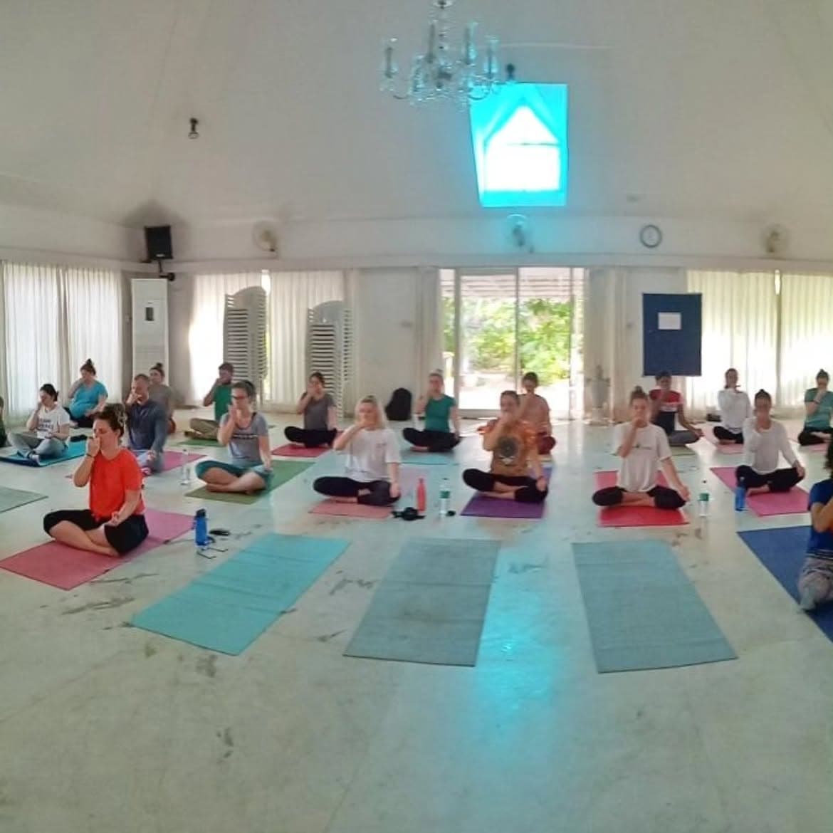 Workshop participants seated for a guided breathing practice