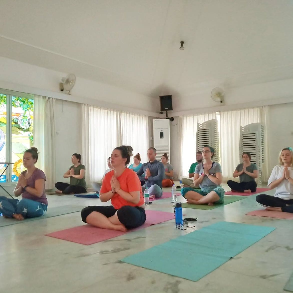 Workshop participants sitting together in a guided yoga practice